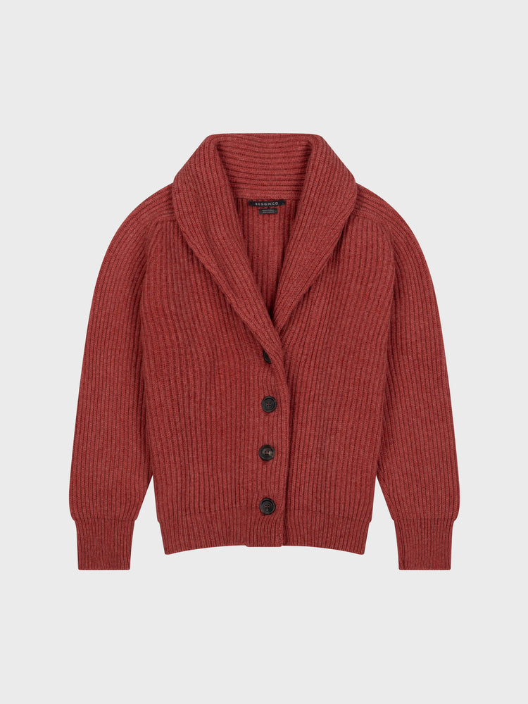 chunky ribbed red cashmere shawl collar cardigan with horn buttons on a grey background