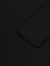 Close-up of a black cashmere dress sleeve