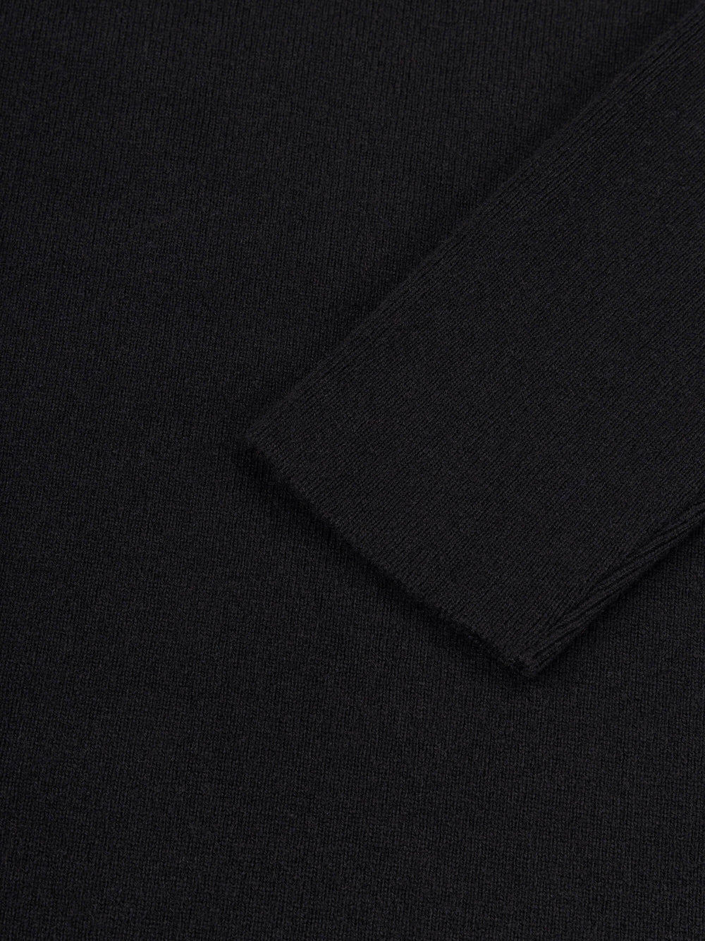 Close-up of a black cashmere dress sleeve