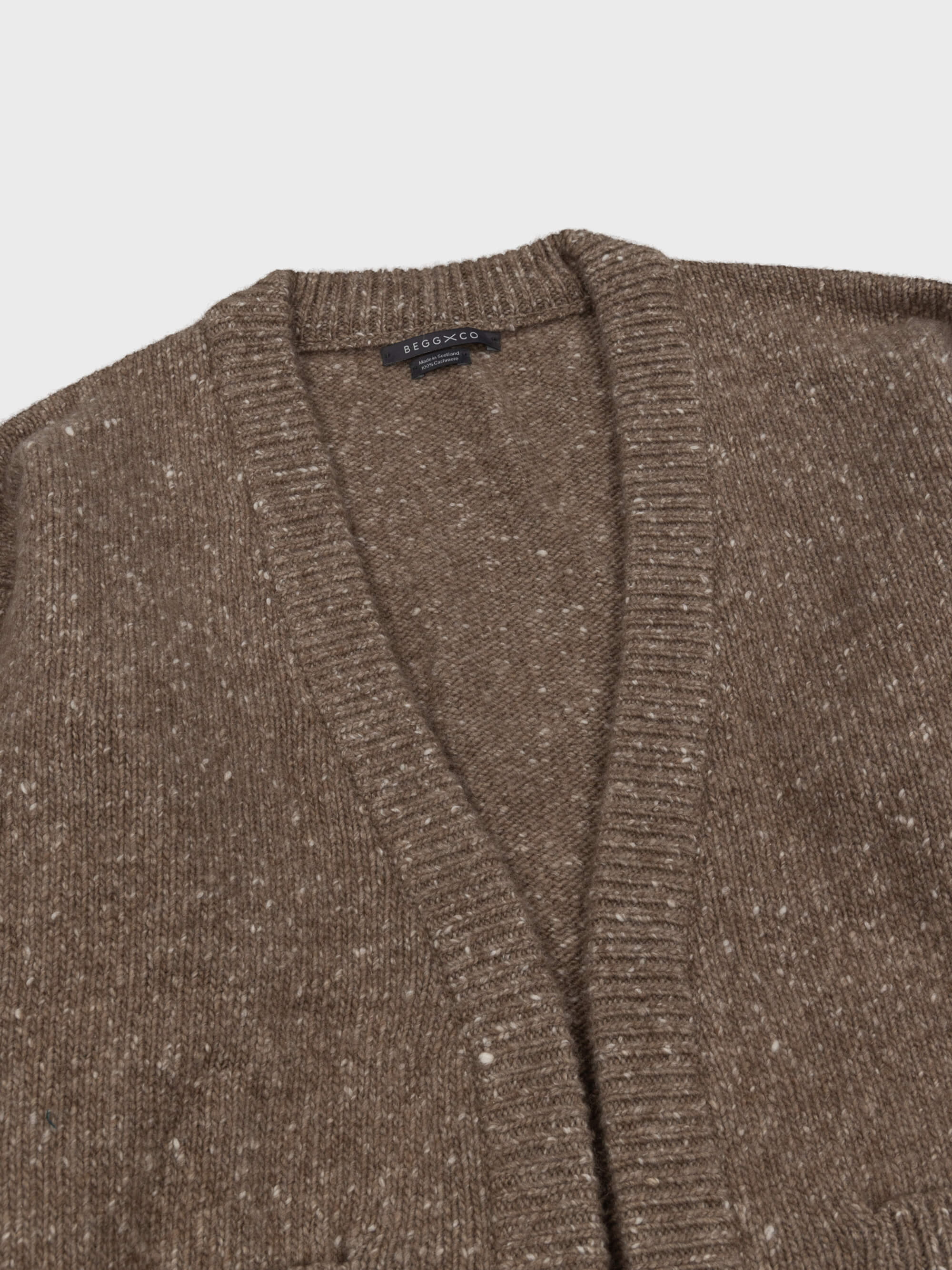 marl brown chunky cashmere cardigan open front detail on a grey background