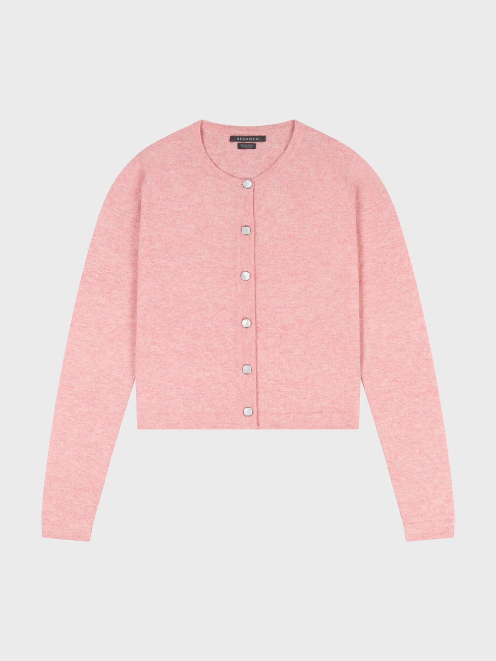 pink cashmere cardigan with pearl buttons on a grey background