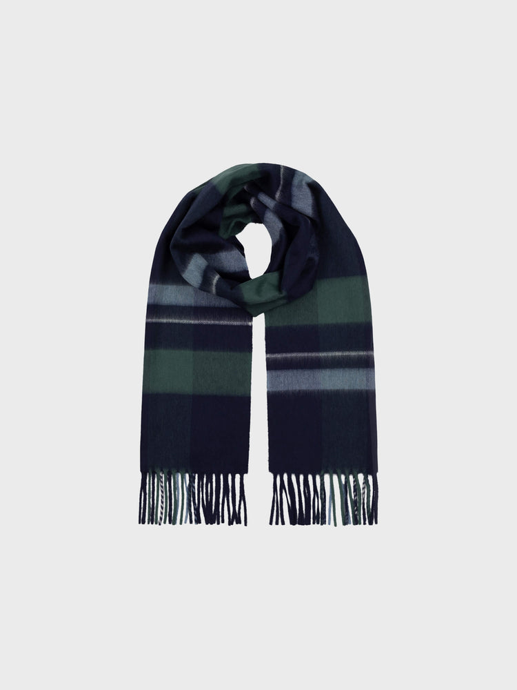Plaid scarf with fringes on a light gray background