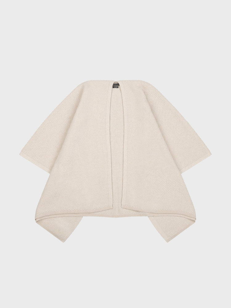 beige cashmere poncho on a grey background
