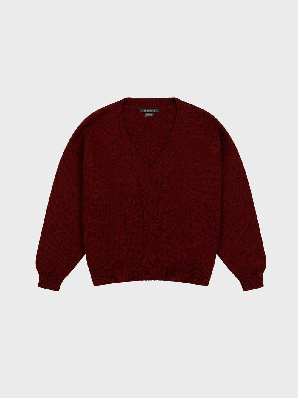 red cashmere v-neck sweater with cable knit detail down middle on grey background