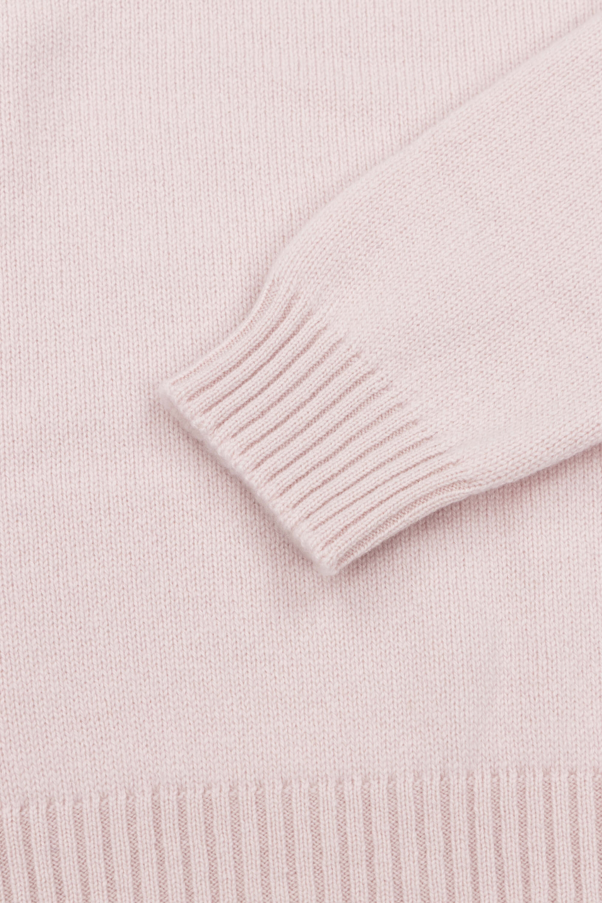 pale pink cashmere crewneck sweater ribbed cuff detail