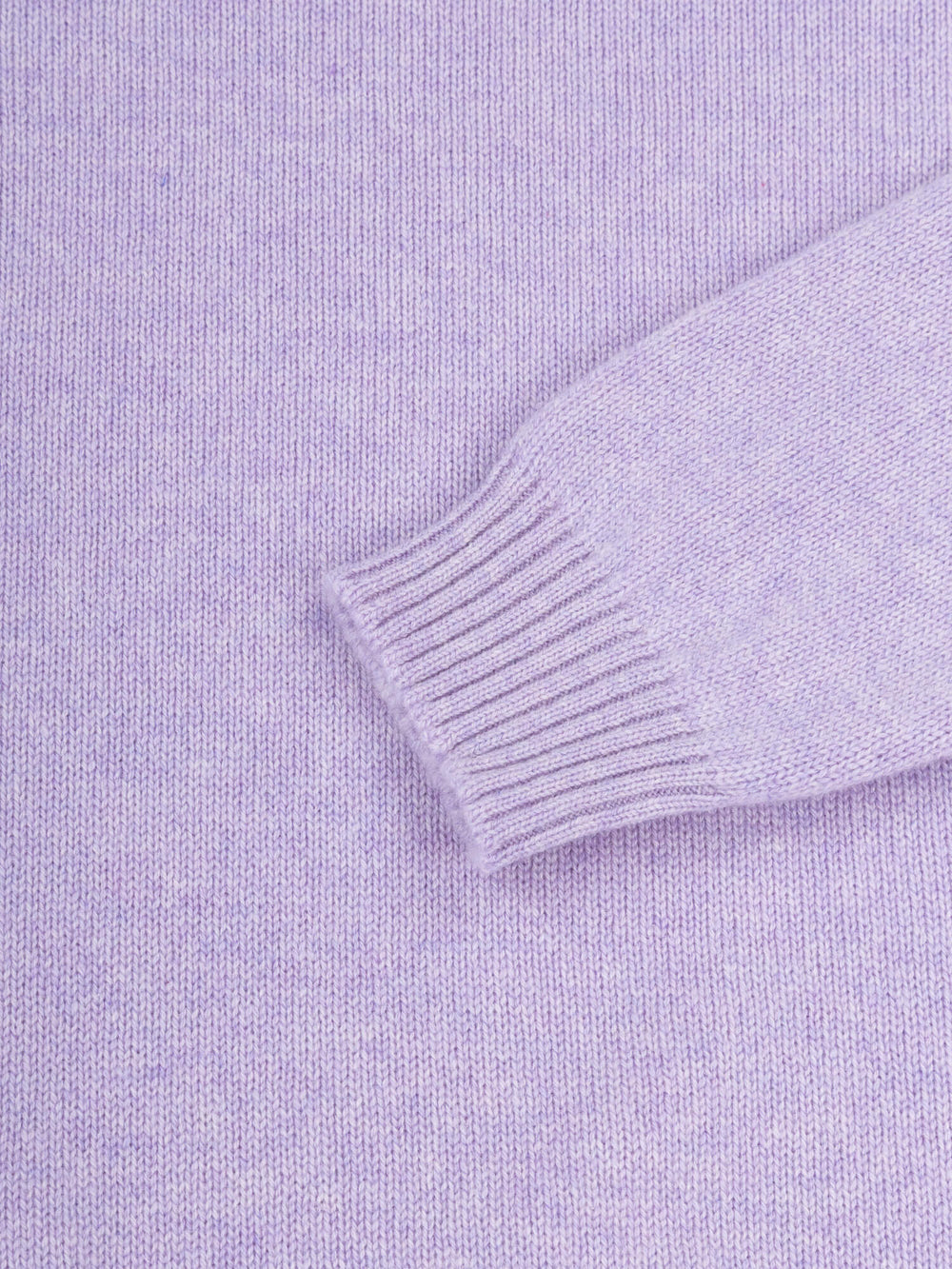 sleeve and cuff detail of a lilac purple cashmere sweater