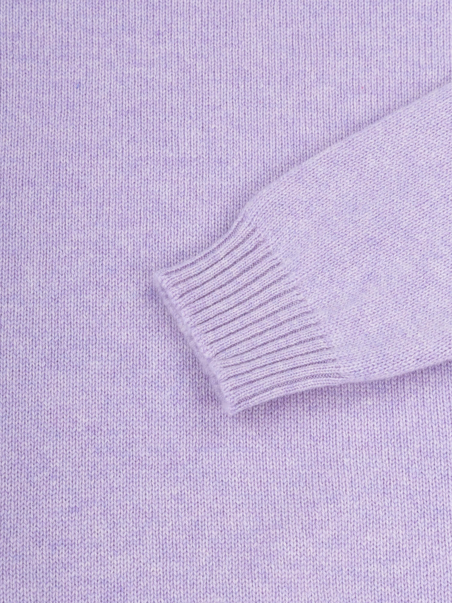 sleeve and cuff detail of a lilac purple cashmere sweater