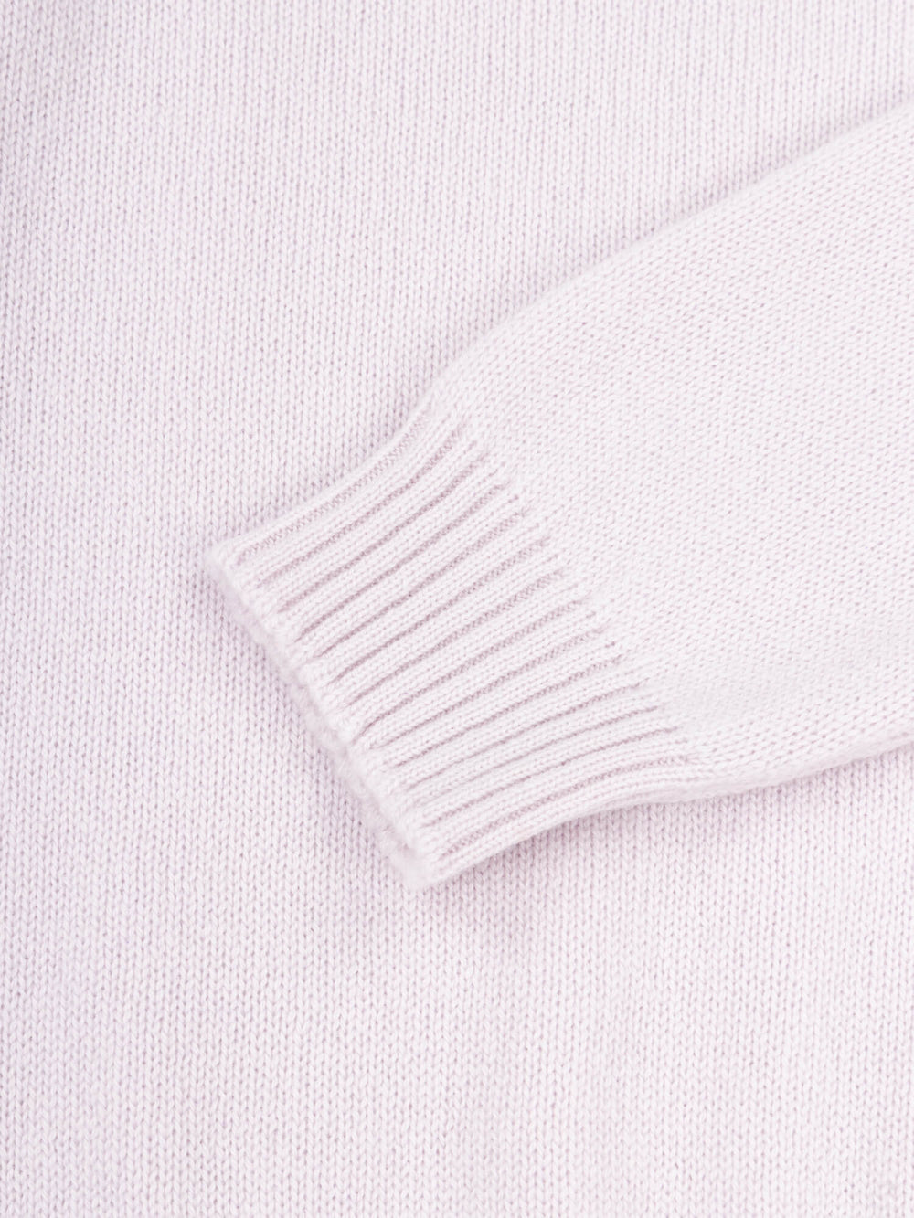 sleeve cuff detail of a light purple cashmere sweater
