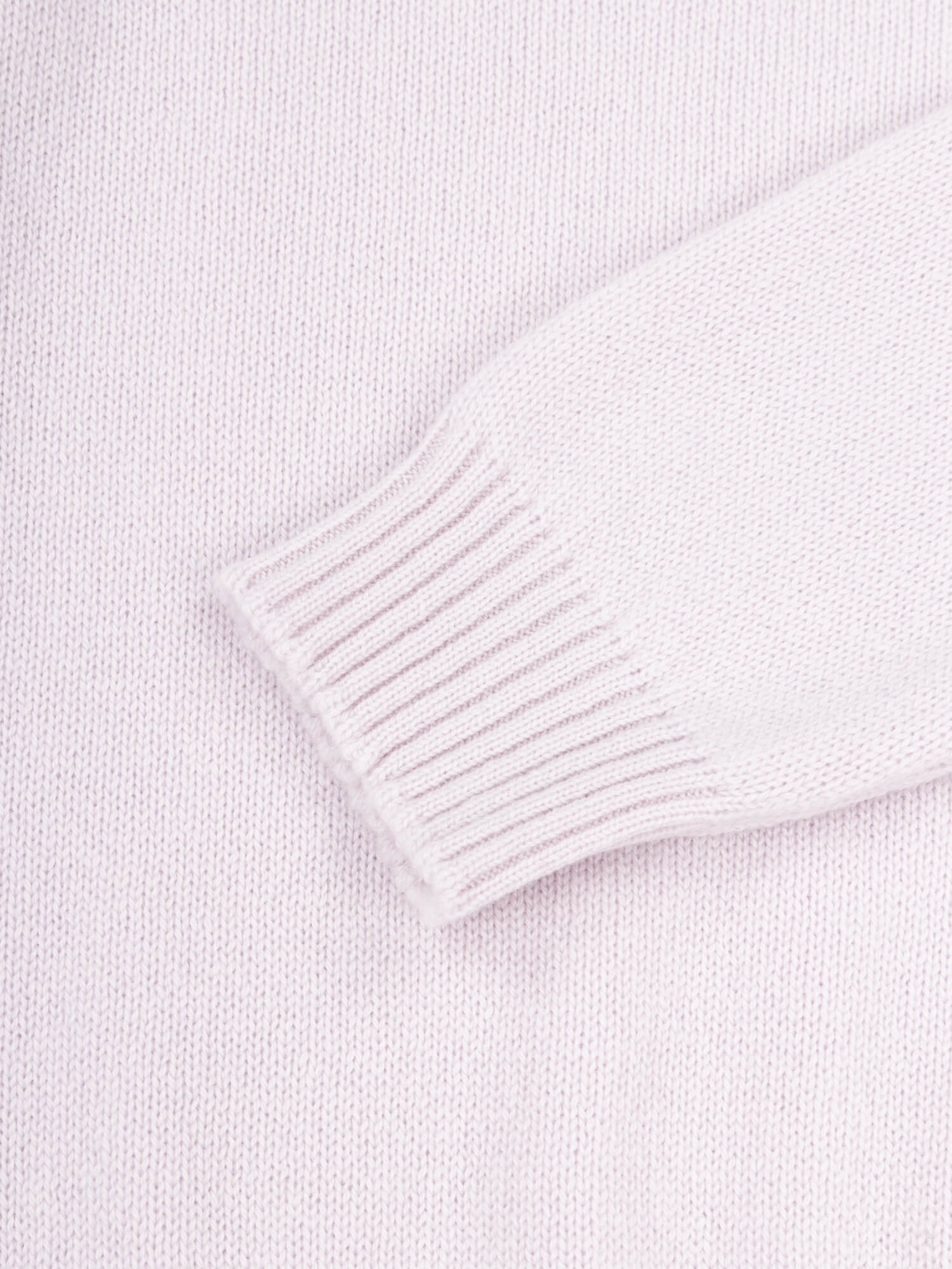 sleeve cuff detail of a light purple cashmere sweater