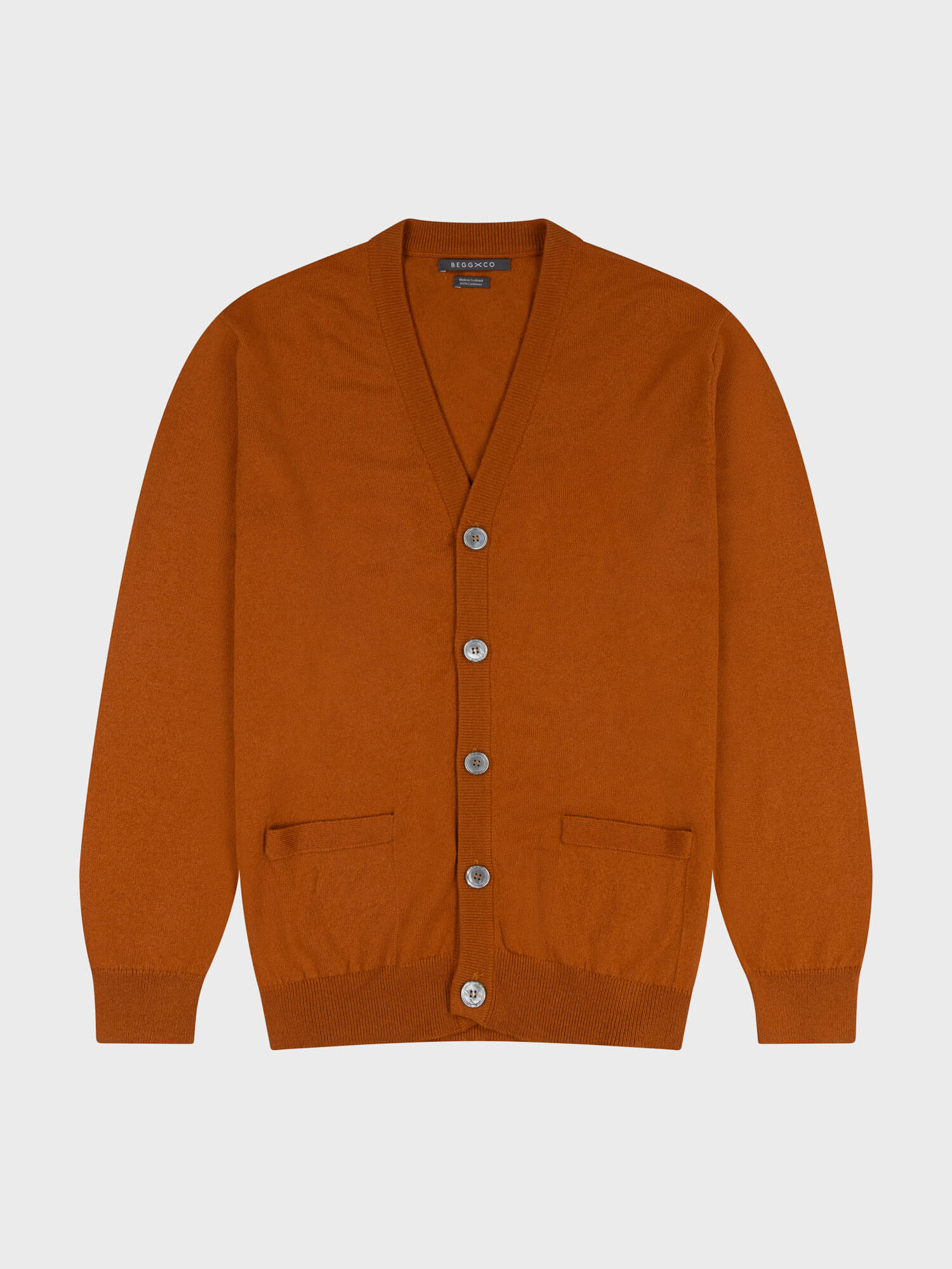 button up brown cashmere cardigan on a grey background