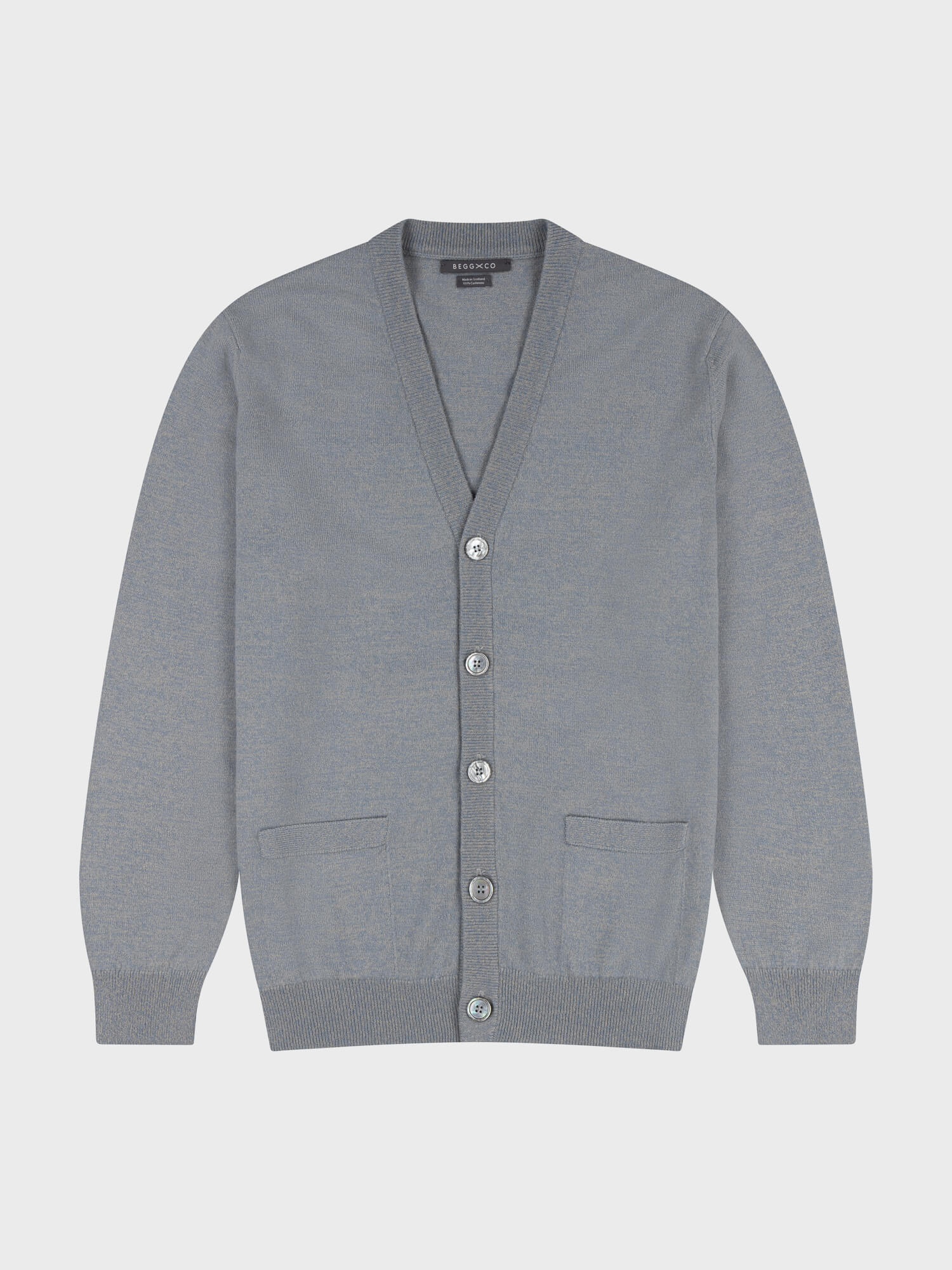 Gray cashmere cardigan with button details on a light gray background