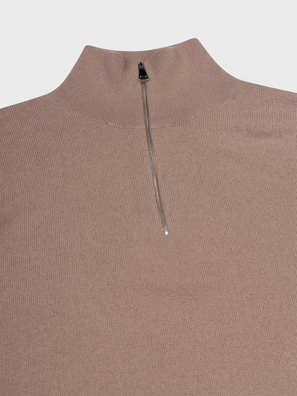 zip detail of a light brown cashmere quarter zip sweater