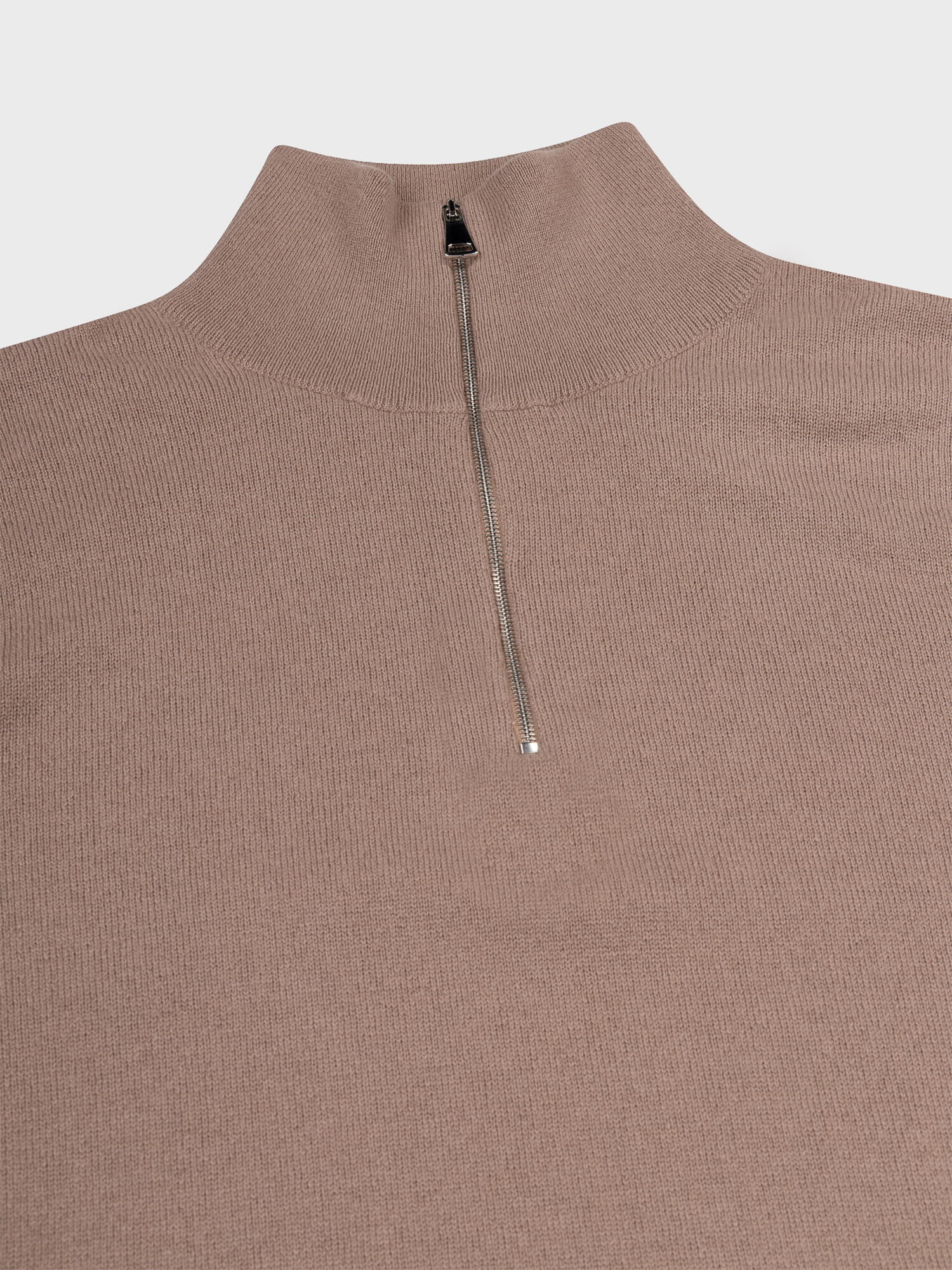 zip detail of a light brown cashmere quarter zip sweater