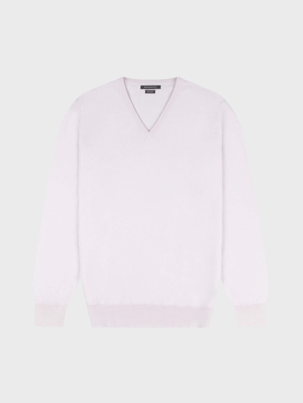 light pink cashmere v-neck sweater on a grey background