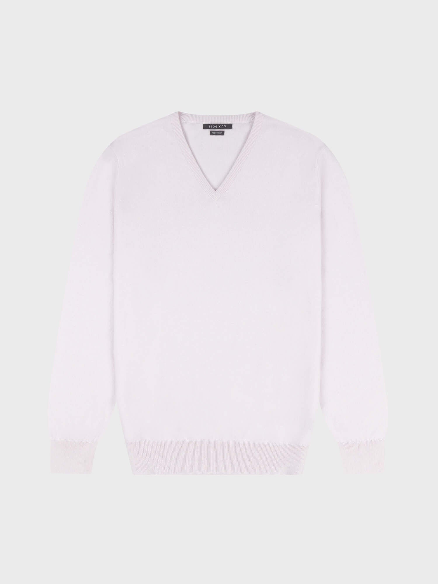 light pink cashmere v-neck sweater on a grey background