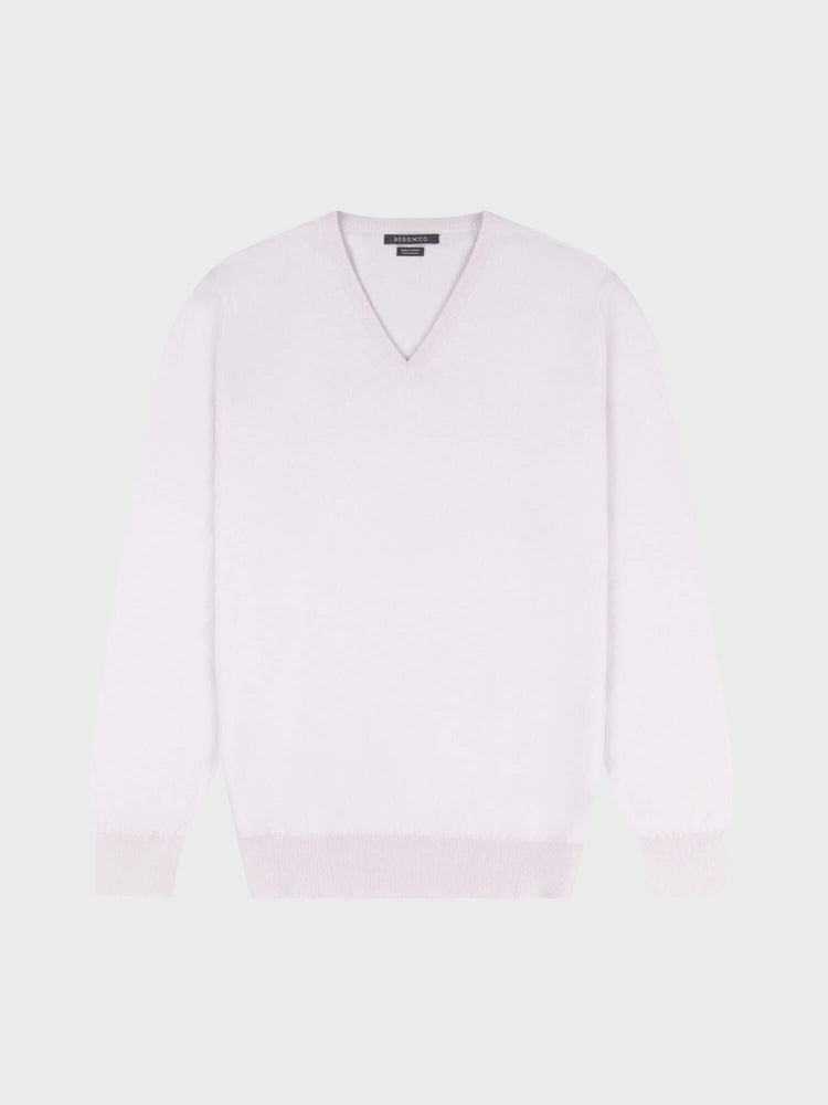 light pink cashmere v-neck sweater on a grey background