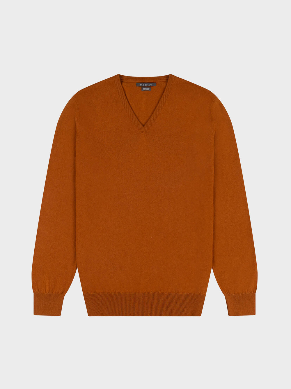 brown cashmere v-neck sweater on a grey background