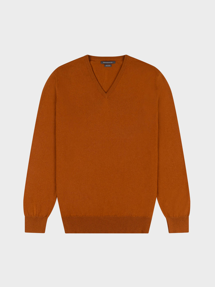 brown cashmere v-neck sweater on a grey background