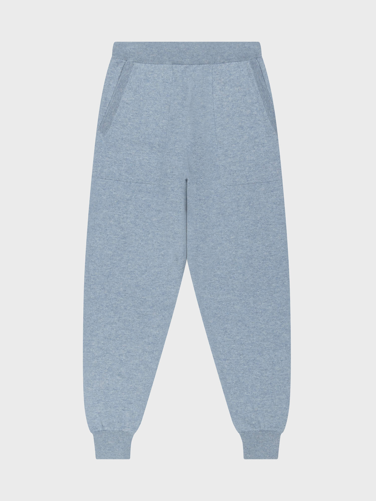 faded blue cashmere sweatpants on a grey background