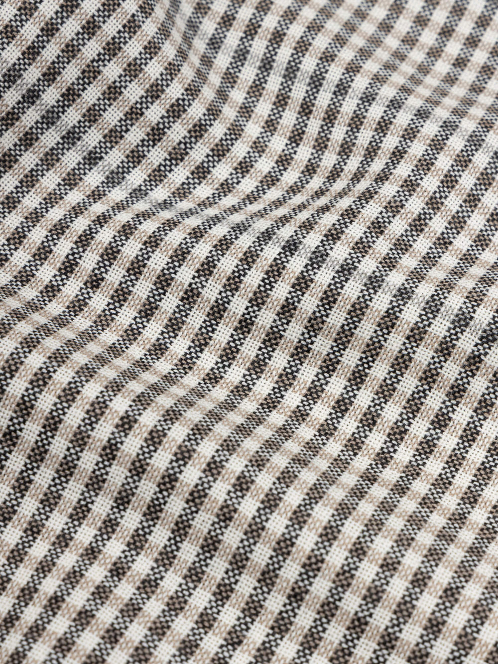 close up of a grey and black check cashmere scarf