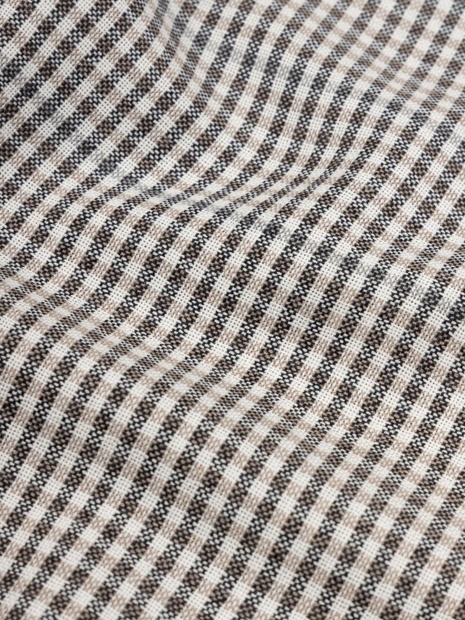 close up of a grey and black check cashmere scarf