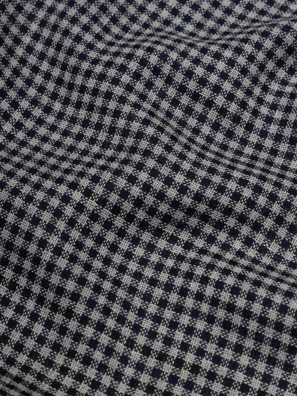 close up of a check black and navy scarf