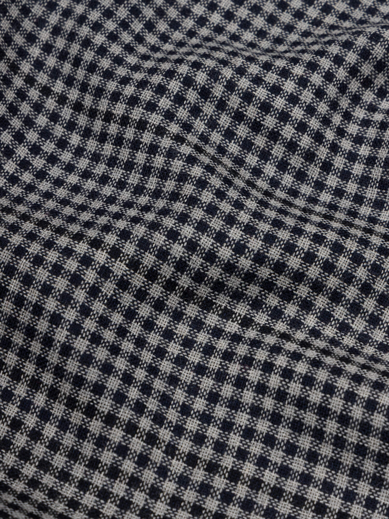 close up of a check black and navy scarf