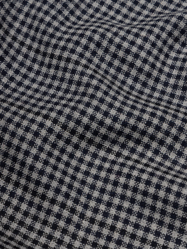 close up of a check black and navy scarf