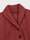 chunky ribbed red cashmere shawl collar detail cardigan with horn buttons on a grey background