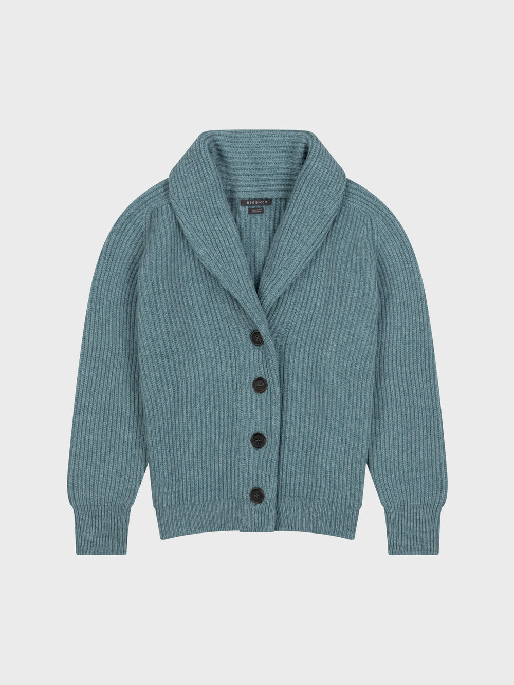 chunky ribbed green cashmere shawl collar cardigan with horn buttons on a grey background