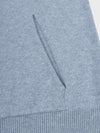 detail of faded blue cashmere hoodie pocket