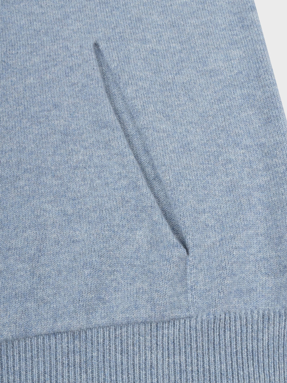 detail of faded blue cashmere hoodie pocket