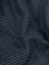 close up of a navy scarf with blue and green stripes 