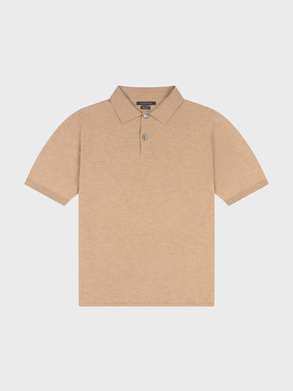 beige cashmere short sleeve polo on a grey background