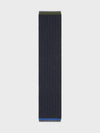 Dark blue scarf with a subtle pattern on a light gray background