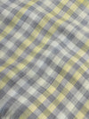 close up of a cashmere scarf with grey and yellow checks