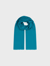 lightweight teal cashmere scarf on a grey background