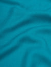 close up of a lightweight teal cashmere scarf