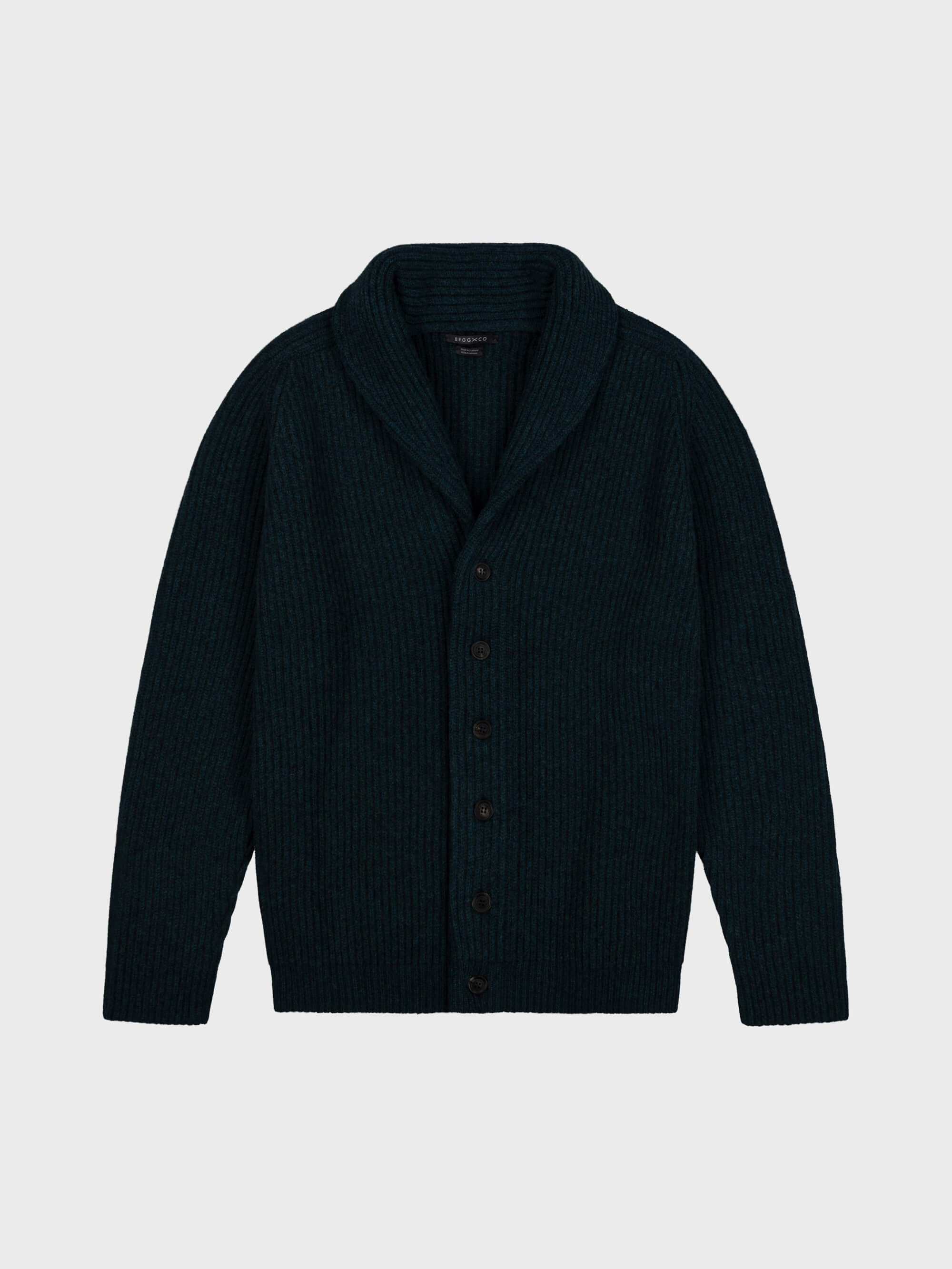 chunky ribbed dark green cashmere shawl collar cardigan on a grey background