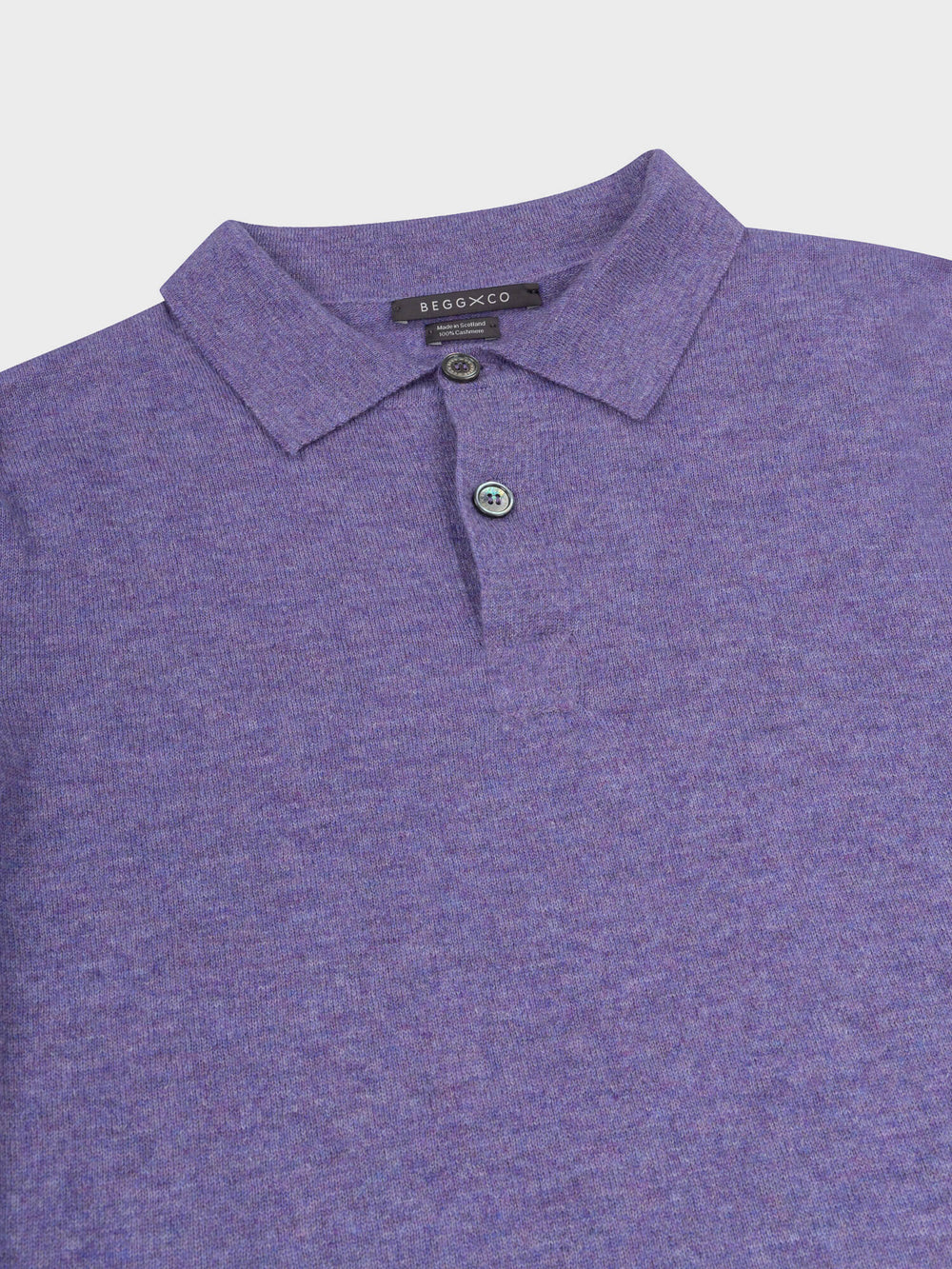 collar and button detail of a purple short sleeve cashmere polo