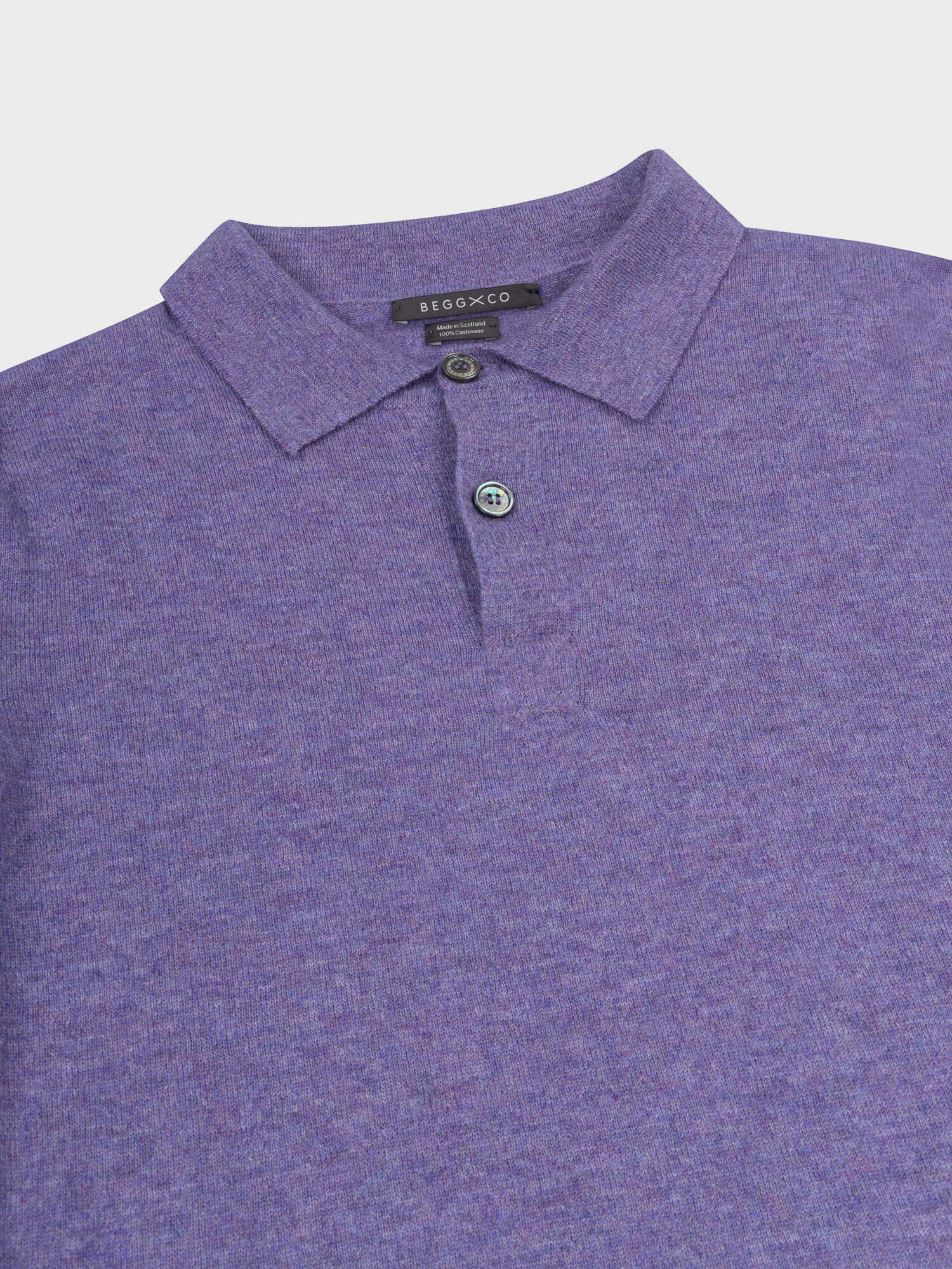 collar and button detail of a purple short sleeve cashmere polo