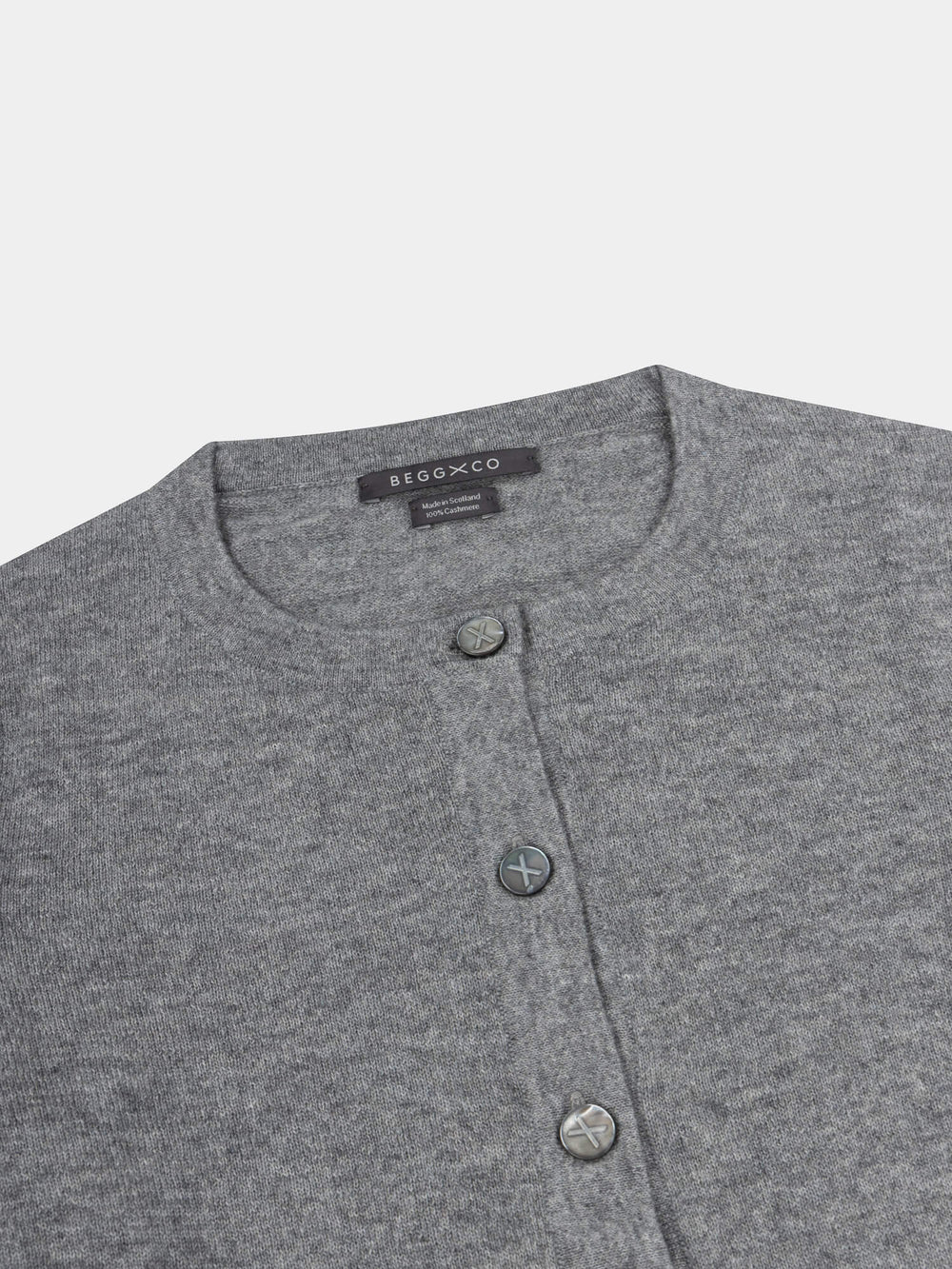 Gray button-up cardigan with brand label on a light gray background