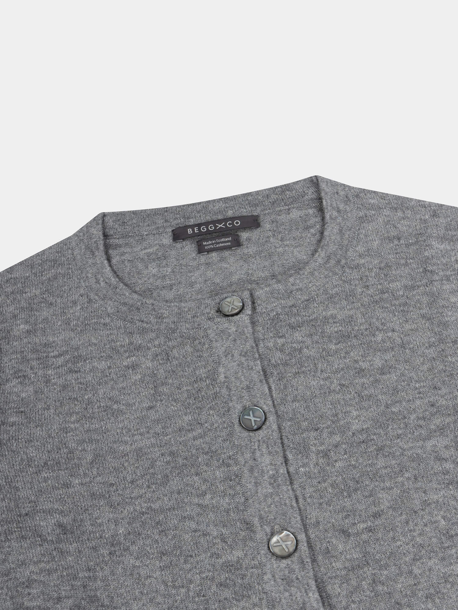 Gray button-up cardigan with brand label on a light gray background