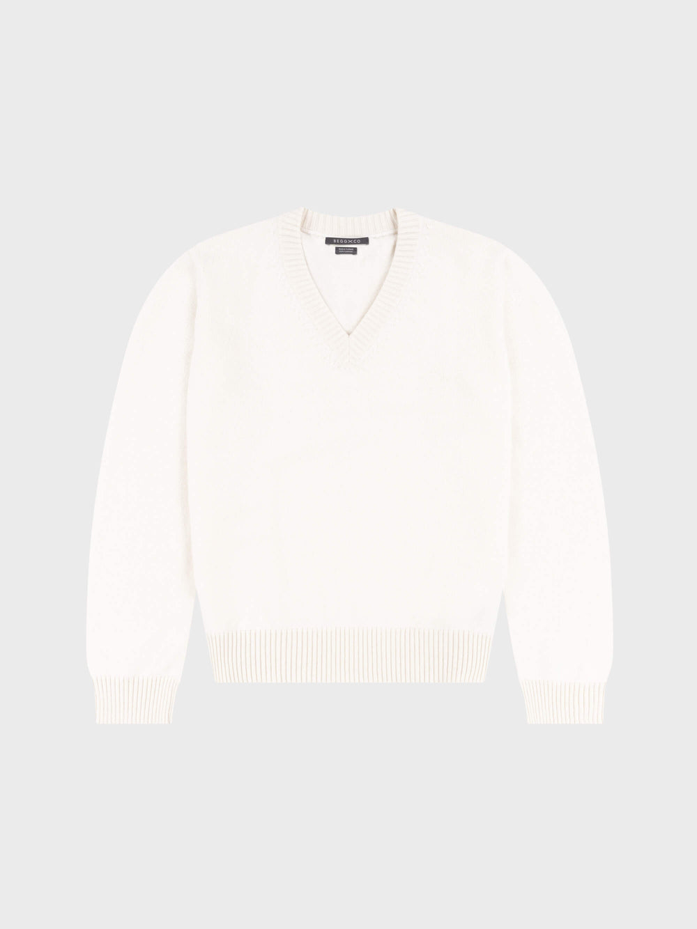 mens white vneck cashmere sweater on a grey background