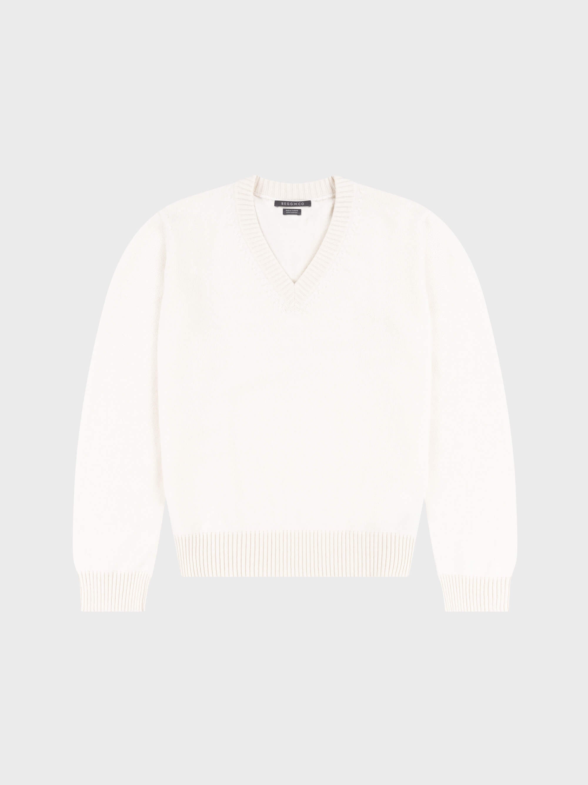 mens white vneck cashmere sweater on a grey background