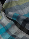 close up of a square scarf with grey, blue and yellow check design