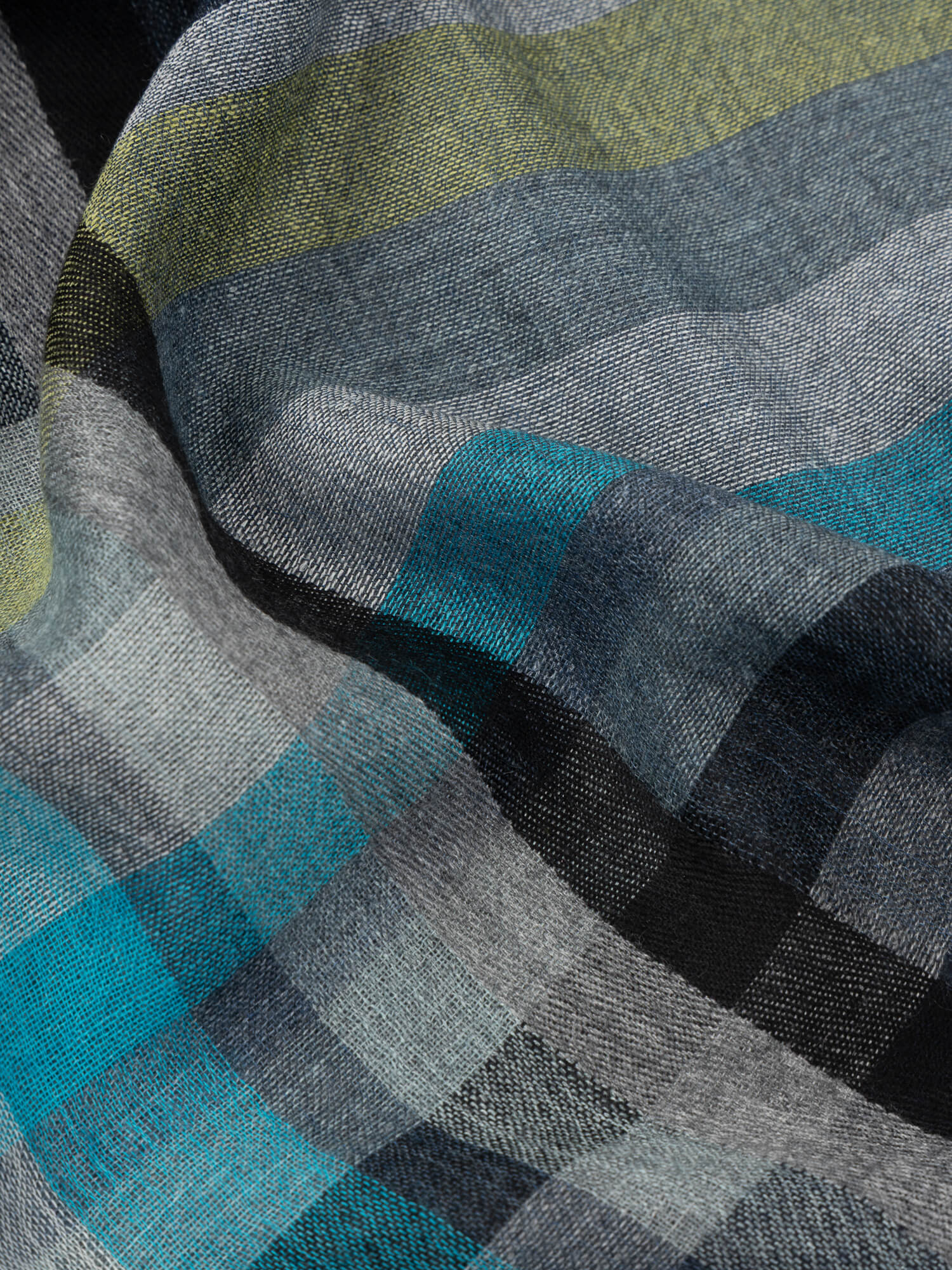 close up of a square scarf with grey, blue and yellow check design