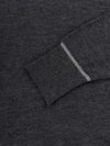 mens dark grey cashmere crewneck sweater with light grey piping cuff details on a grey background
