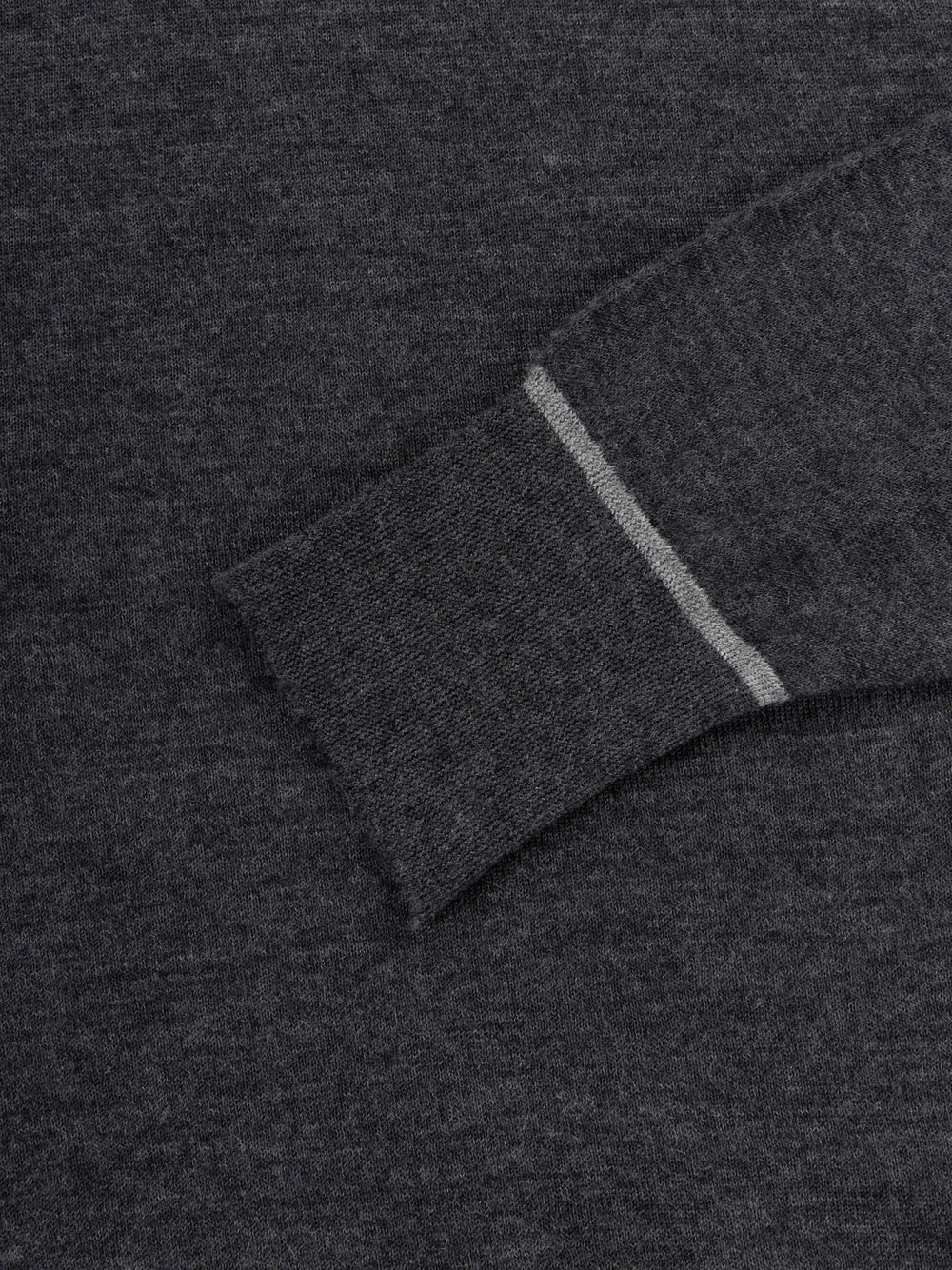 mens dark grey cashmere crewneck sweater with light grey piping cuff details on a grey background
