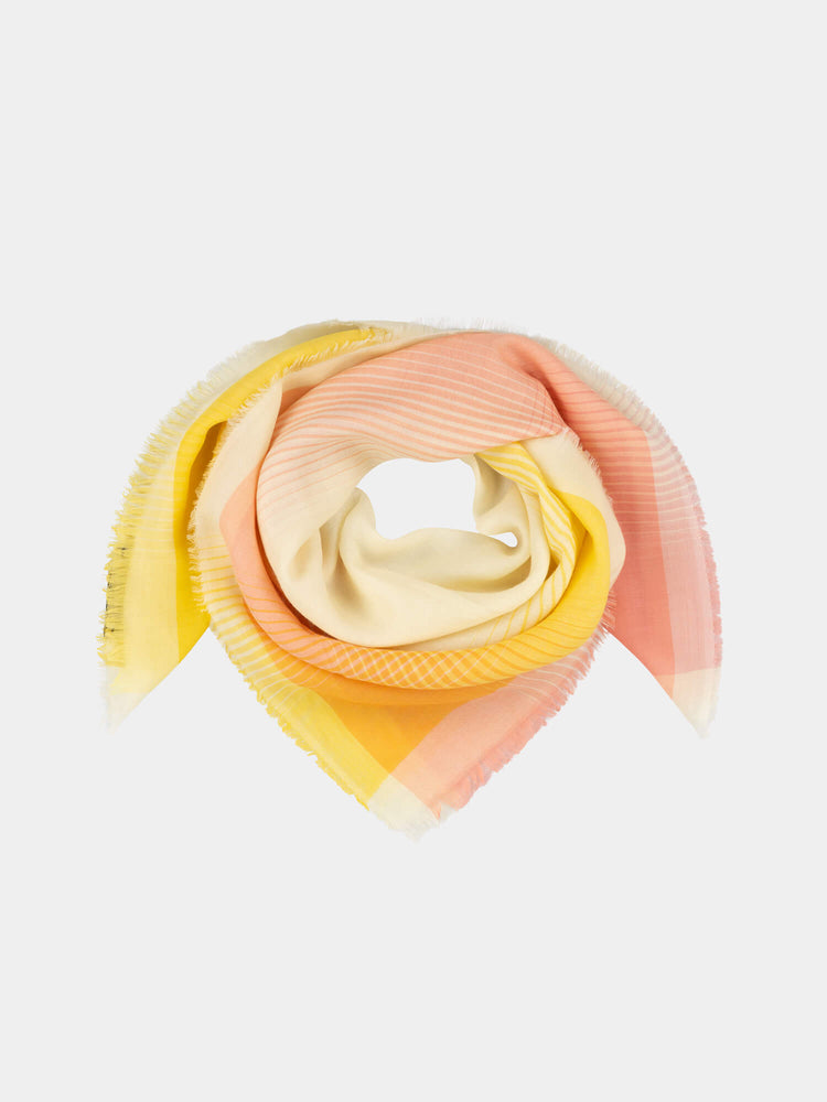 orange and yellow square cashmere scarf with a gradient check design on a grey background